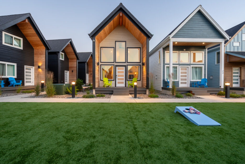 Courtyard with corn hole games and BBQ grills